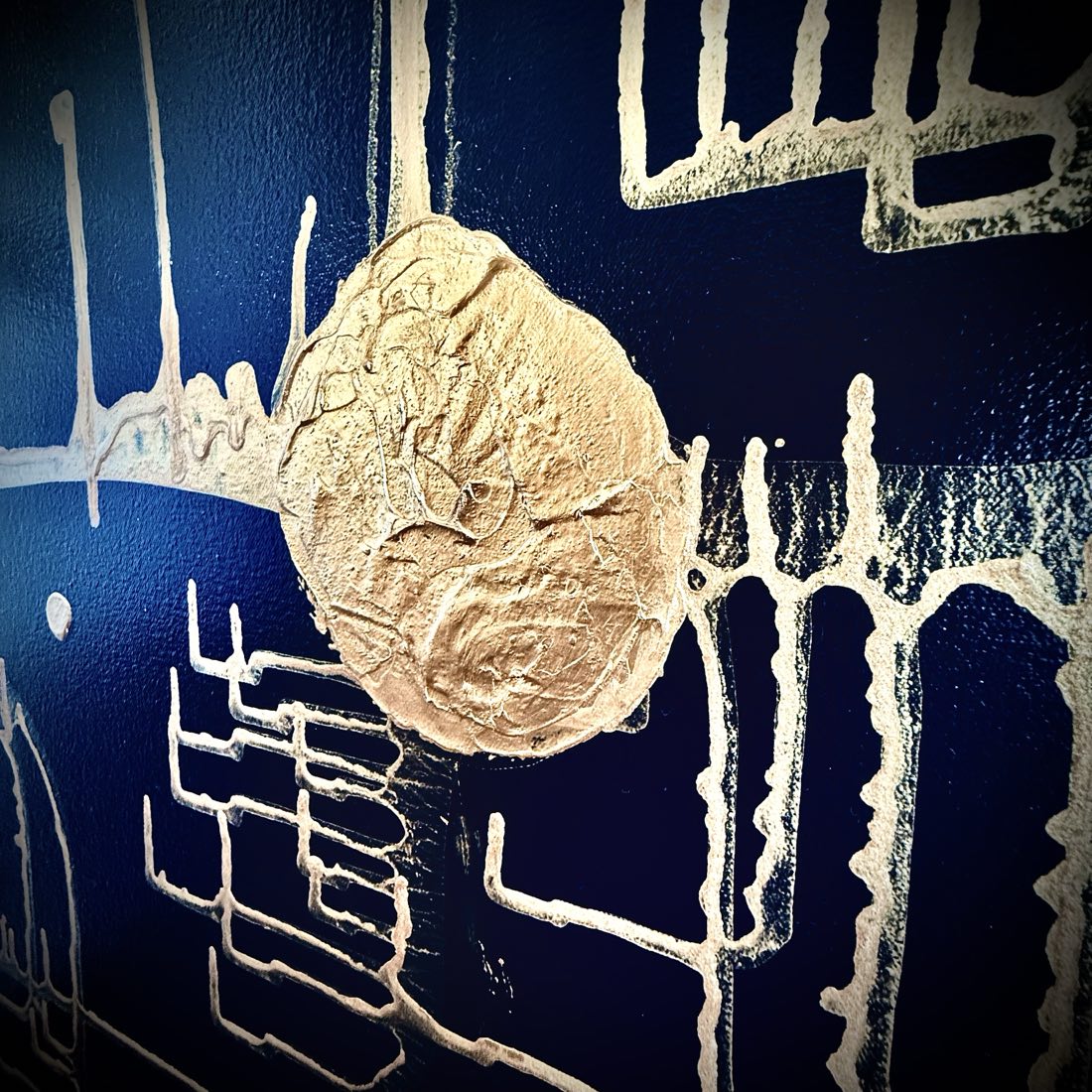 Macro detail of Endurance by D.C. Christian: a large gold metallic-impasto node with comb-like traces over the deep blue ground.